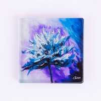 Square glass coaster of a blue flower