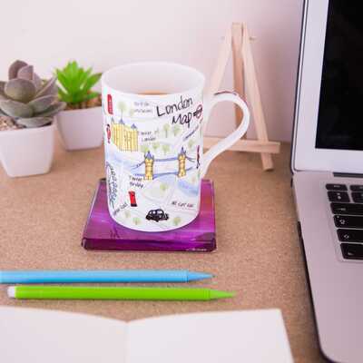 Cup on a ceramic coaster of the painting Moorland vale showing an almost monochrome purple image with hints of orange