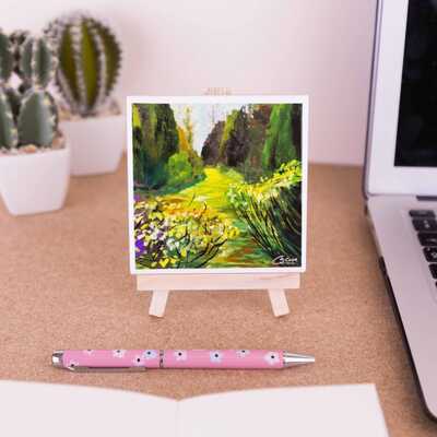 On a mini easel is a coaster of the painting Tranquil dreams