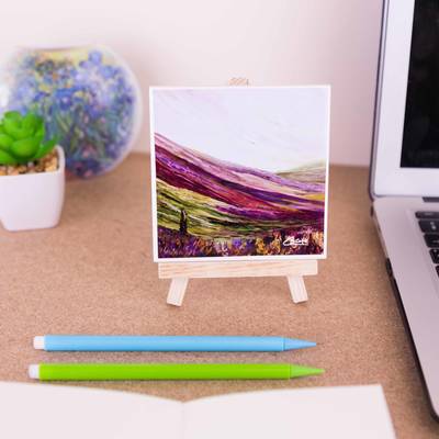 On a mini easel is a ceramic coaster of Pilgrims way