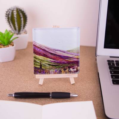 On a mini easel is a glass coaster of the painting Pilgrim's way