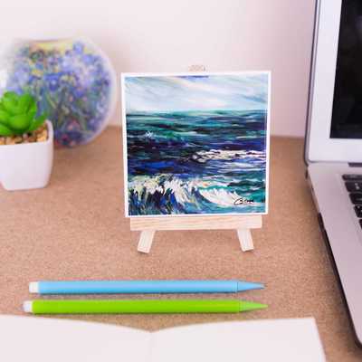 On a mini easel is a ceramic coaster of the painting Rhapsody in blue