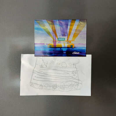Magnet of the painting Transporter Bridge sunshine holding a child's train drawing